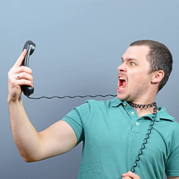 istock Man having unpleasant conversation on telephone 650530674