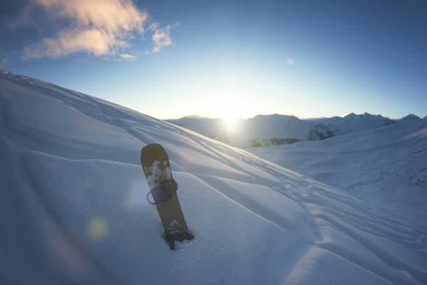 istock Snowboard on the background of a snow mountain panorama 650543952