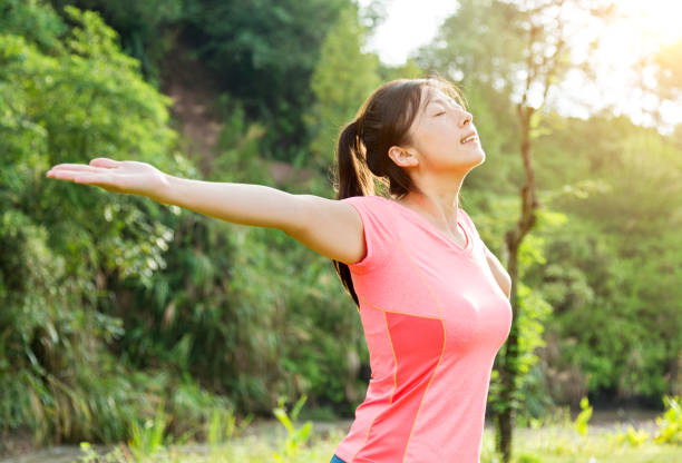 istock Asian woman enjoying fresh air 650549002