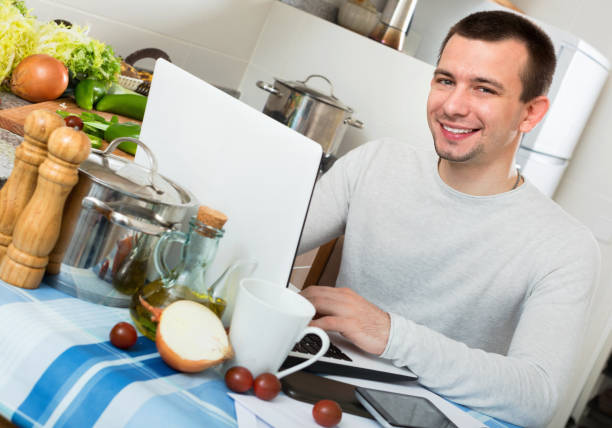 istock Portrait of reflective  guy working with papers and notebook 650555858