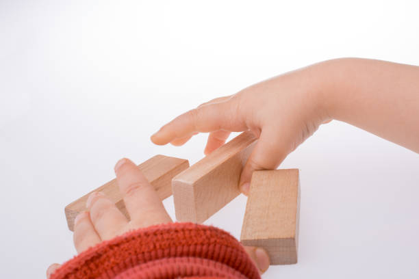 istock child playing with wooden building blocks 650557374
