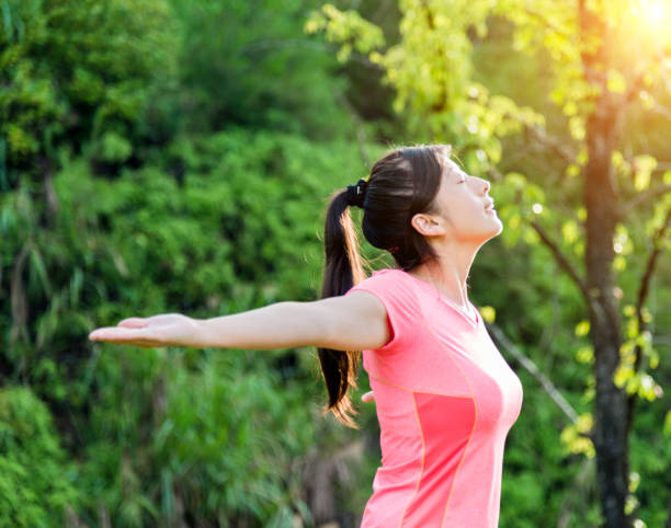 istock Asian woman enjoying fresh air 650557726