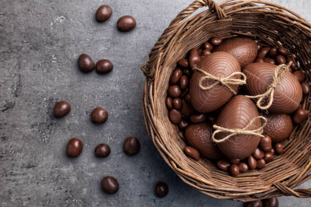 istock Chocolate Easter bunny and eggs on wooden background 650558512