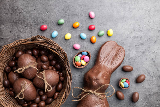 istock Chocolate Easter bunny and eggs on wooden background 650565598