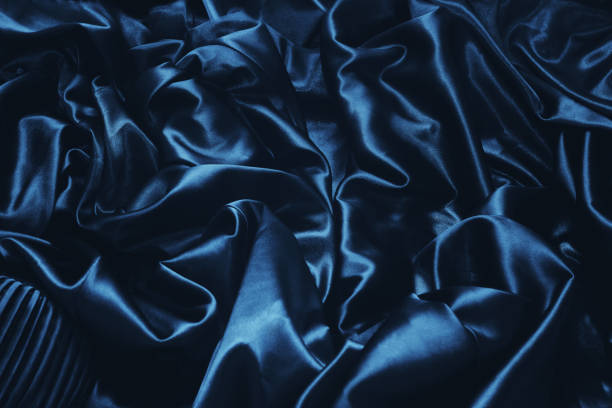 istock texture of a dark blue silk close up 650576392
