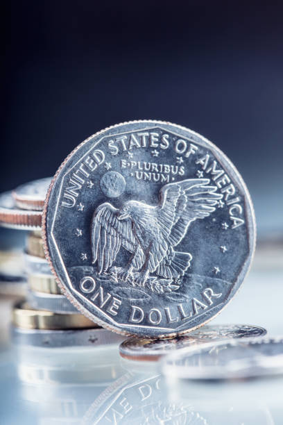 istock Dollar coins. USA Dollar coins standing on edge supported on coins 650589568