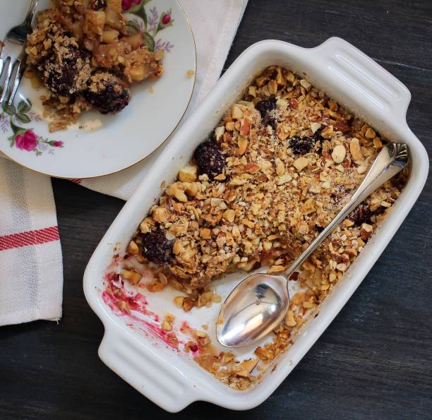 istock Homemade Apple Blackberry crumle on white baking dis 650590394