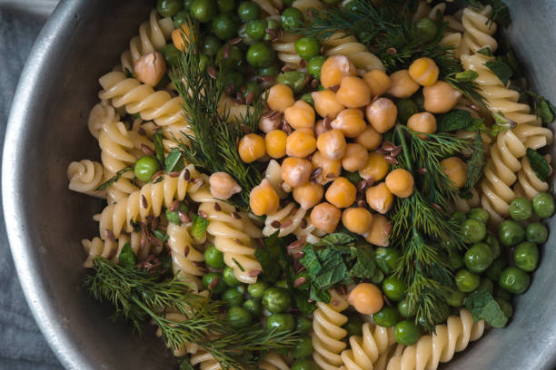 Vegetarian pasta with peas and mint  in the metal bowl horizontal