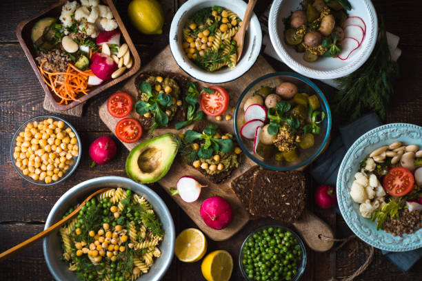 istock Different salad and snack on the wooden table top view 650606774