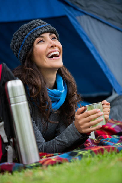 istock Hiker having a cup of coffee in tent 650606996