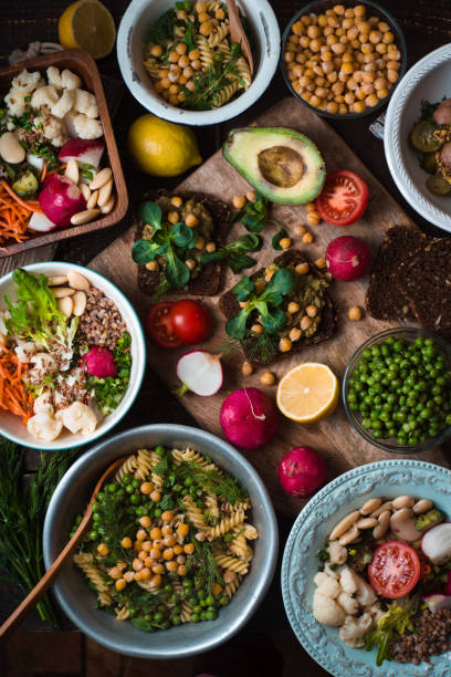 istock Different salad and appetizer on the wooden table top view 650607012