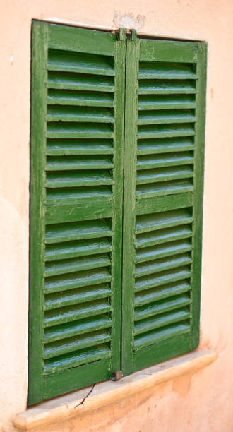 istock Spanish style shutters in a old house 650616932