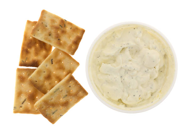 istock Container of French onion dip with crackers 650617328