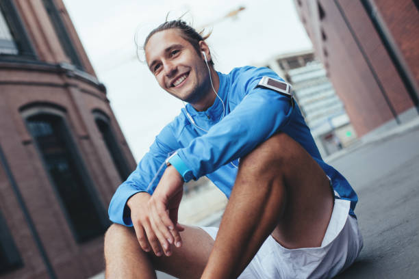 istock Athlete sitting on the street 650620556