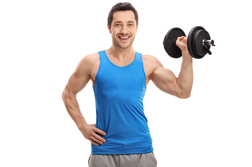 Young man lifting a dumbbell isolated on white background