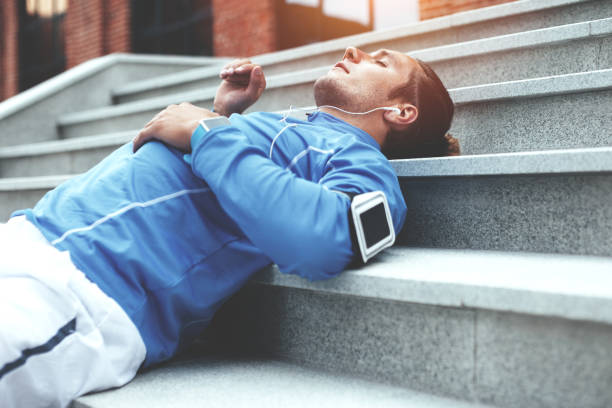 istock Tired athlete resting on the stairs 650624154