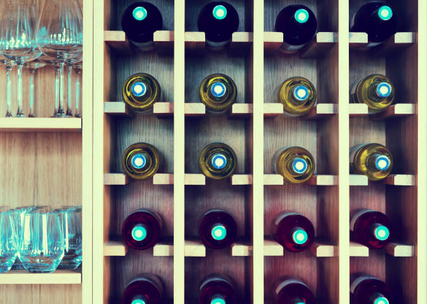 istock shelves with wine bottles 650628460