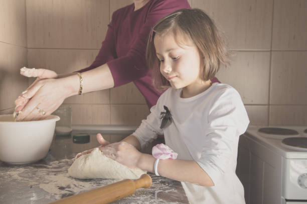 istock Little cute girl making cookies 650634898