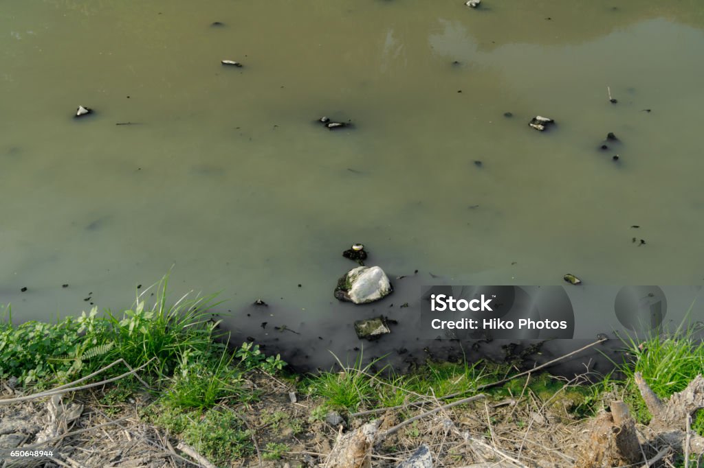 Environment problem, waste water, industrial sewage In the canal near the urban community Accidents and Disasters Stock Photo