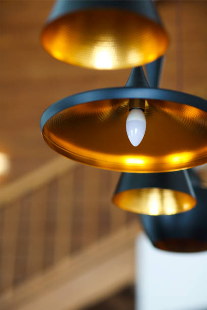 istock Black pendant lamp on ceiling wood wall 650654570