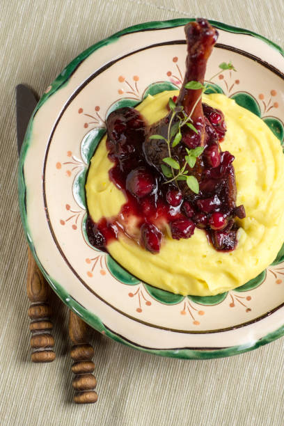 istock Roasted Duck Leg with Mashed Potatoes, Apples and Red Currants in Red Wine Sauce 650662590