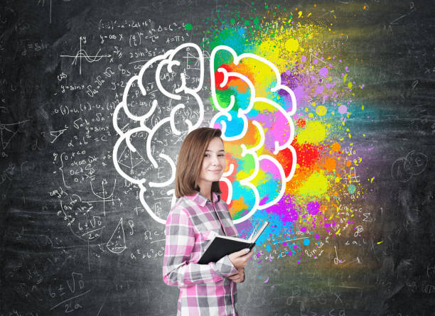 istock Young girl with a book and large brain 650667520