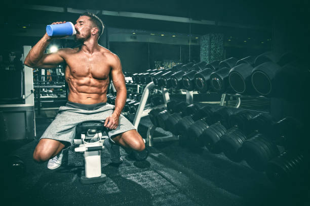 istock Man in the gym drinking energy drink 650676390