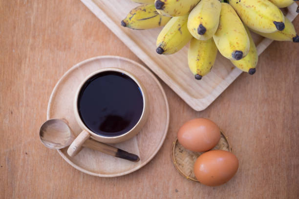 istock Soft-boiled egg and banana with hot coffee, Breakfast set 650683708
