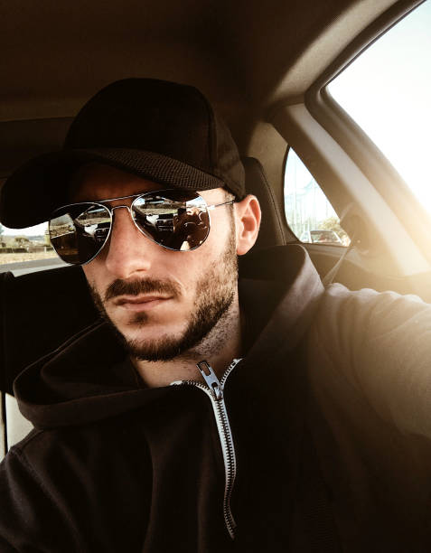 istock man with cape take a selfie in the car 650684128