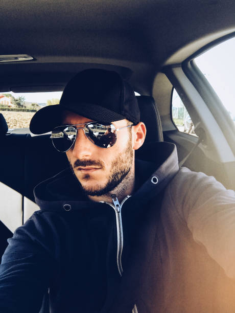 istock man with cape take a selfie in the car 650684184