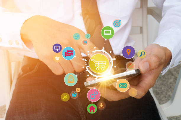 istock shopping cart with application software icons on mobile 650689742