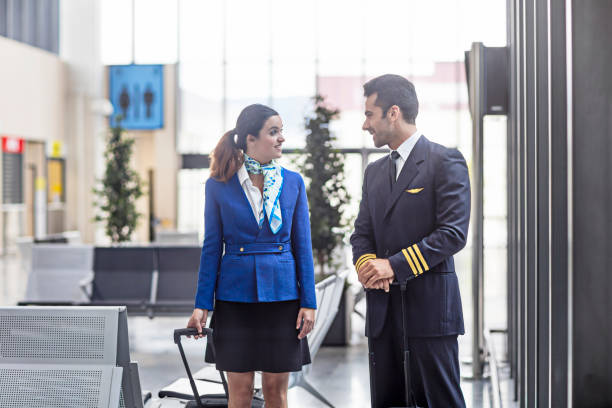 istock Stewardess communicating with pilot in airport 650689780