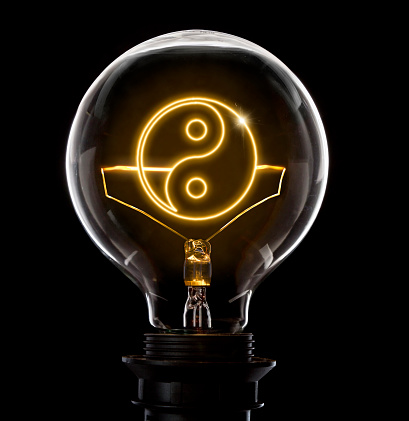 Clean and shiny lightbulb with a Ying Yang symbol as a glowing wire.(series)