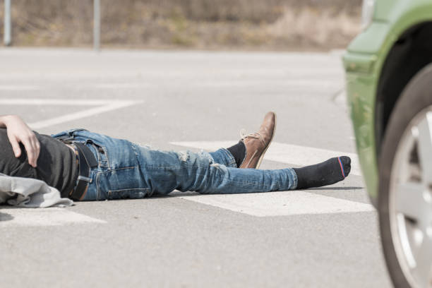 istock Traffic accident.Young man hit by a car 650700456