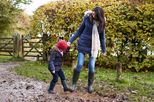 istock Mother And Daughter Holding Hands On Autumn Walk 650702568