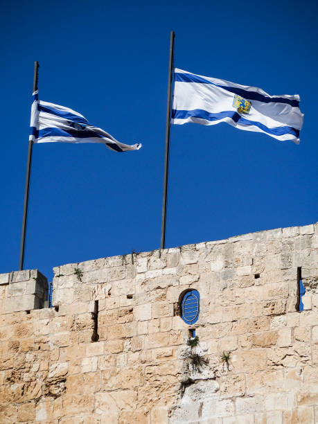 istock Flags Flying over Ancient Wall in Jerusalem Israel 650703920