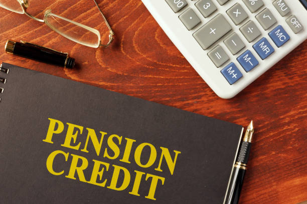 istock Book with title pension credit and calculator. 650706268