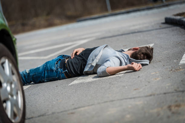 istock Traffic accident.Young man hit by a car 650707526