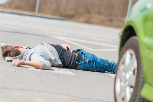 istock Traffic accident.Young man hit by a car 650707528