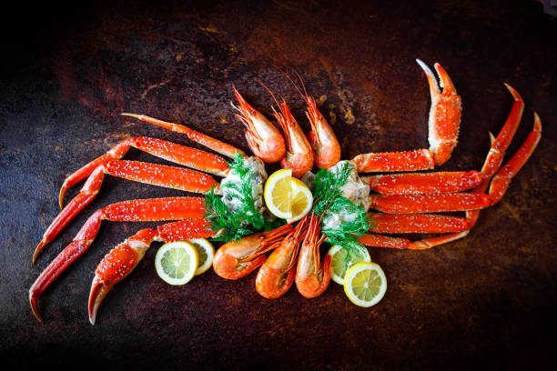 istock Crab legs with lemon and shrimps 650717550