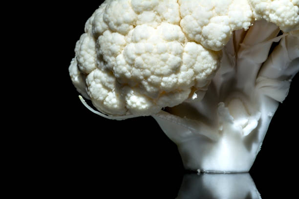 istock Fresh cauliflower close-up macro isolated on a black background 650718698