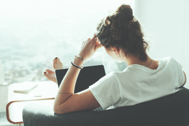 istock Woman sitting in office with laptop 650722652