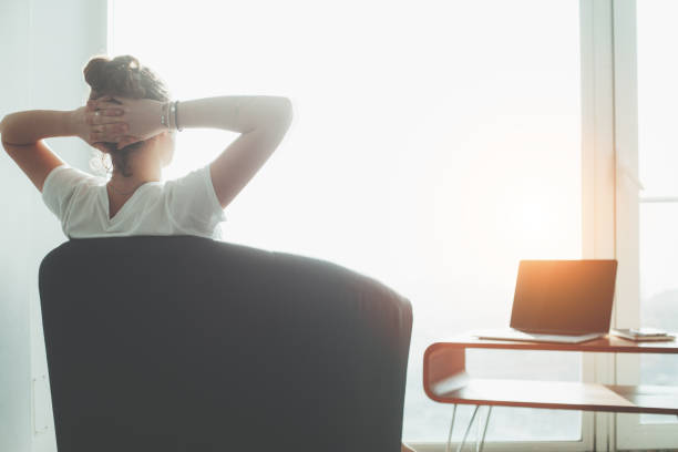 istock Woman sitting in office with laptop 650723170