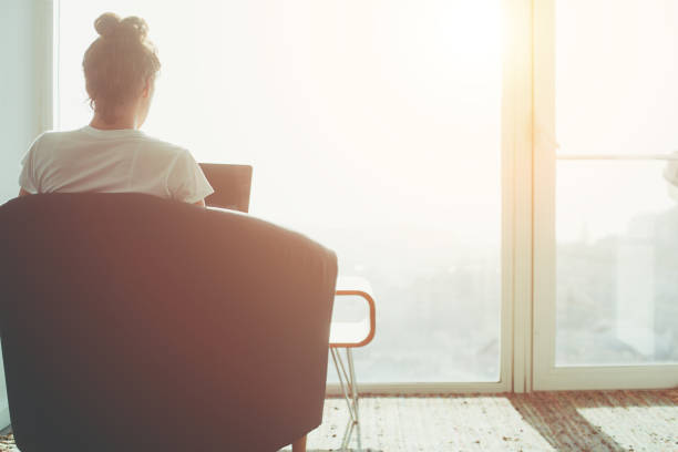 istock Woman sitting in office with laptop 650723172