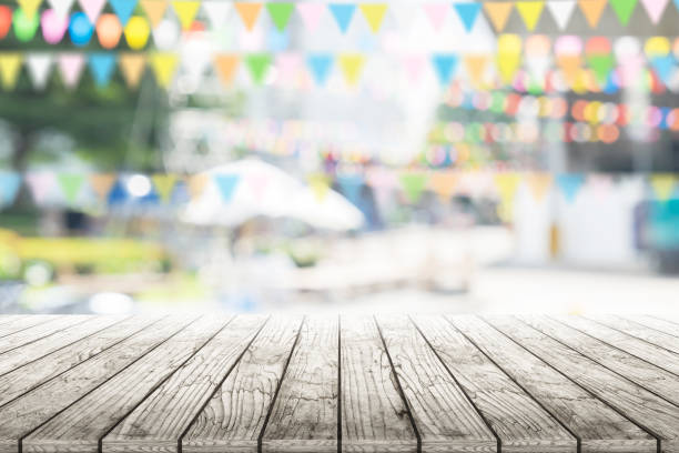 istock Empty wooden table with party in garden background blurred. 650729756