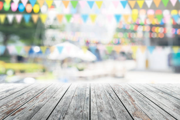 istock Empty wooden table with party in garden background blurred. 650729902