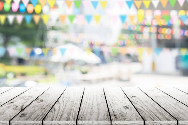 istock Empty wooden table with party in garden background blurred. 650729970
