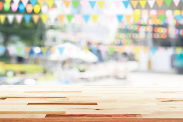 istock Empty wooden table with party in garden background blurred. 650730030