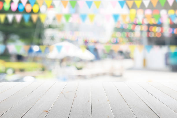istock Empty wooden table with party in garden background blurred. 650730076