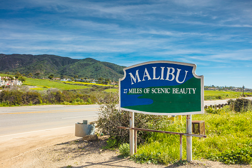 An editorial stock photo of the Malibu sign in Malibu, California. Malibu is a beach city in Los Angeles County, California, situated 30 miles west of Downtown Los Angeles